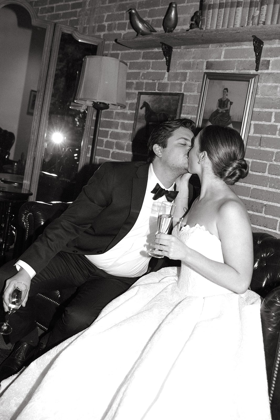 A bride and groom kissing during their bride and groom portraits at the Carondelet House, a DTLA wedding venue