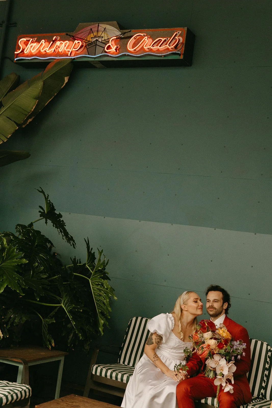 A bride and groom posing for unique wedding photos at their Los Angeles wedding venue