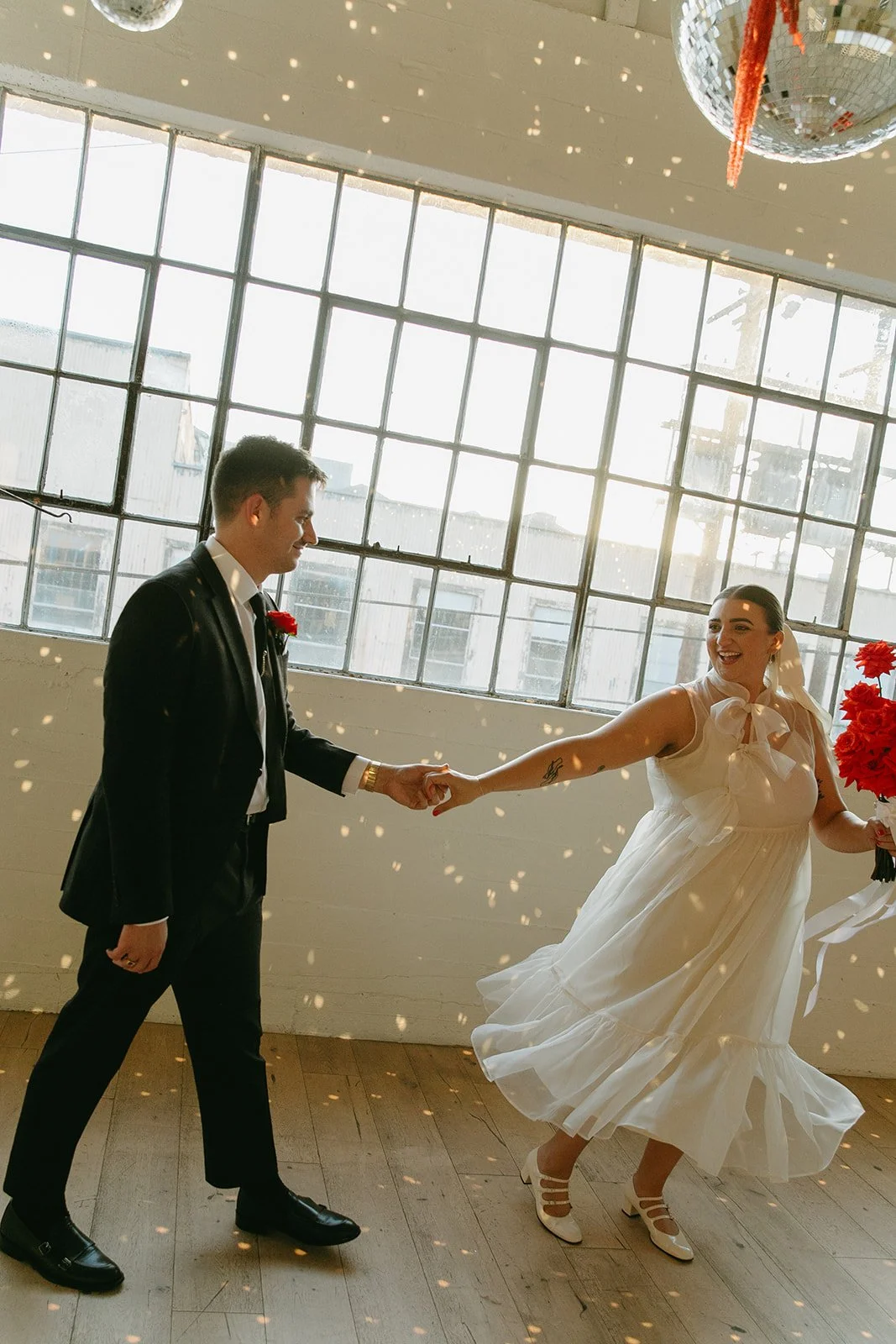 A couple dancing inside of the Revery