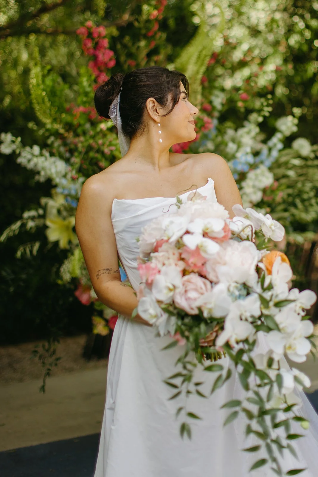 A bride holding a bouquet at The Fig House