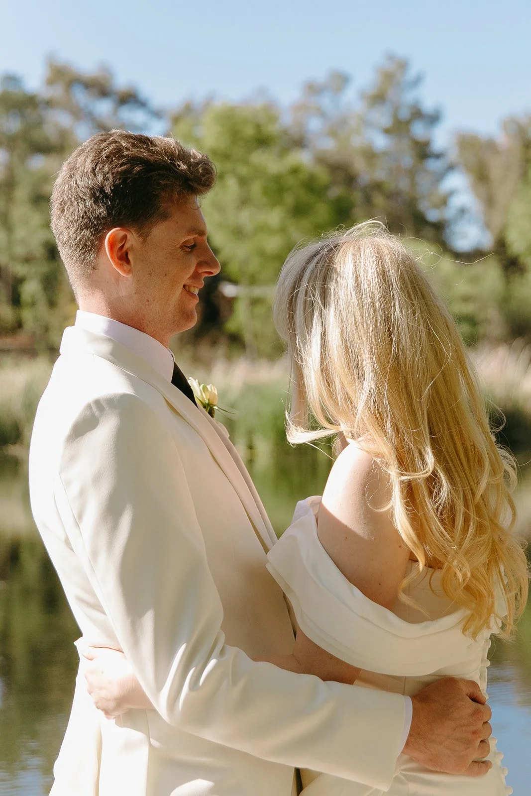 A bride and groom posing for wedding photos