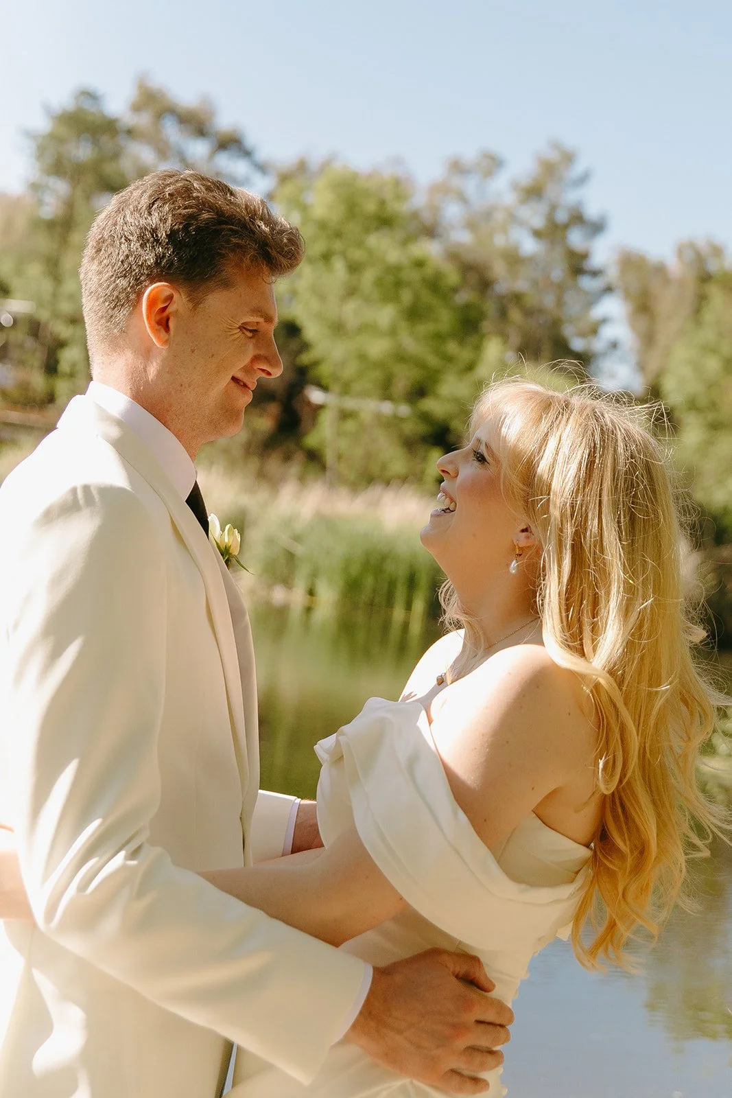 A bride and groom posing for wedding photos
