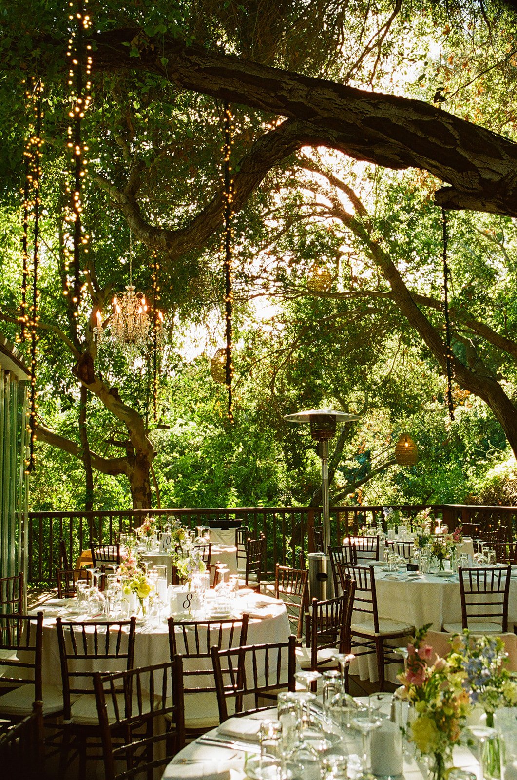 A wedding reception under strong lights at Calamigos Ranch