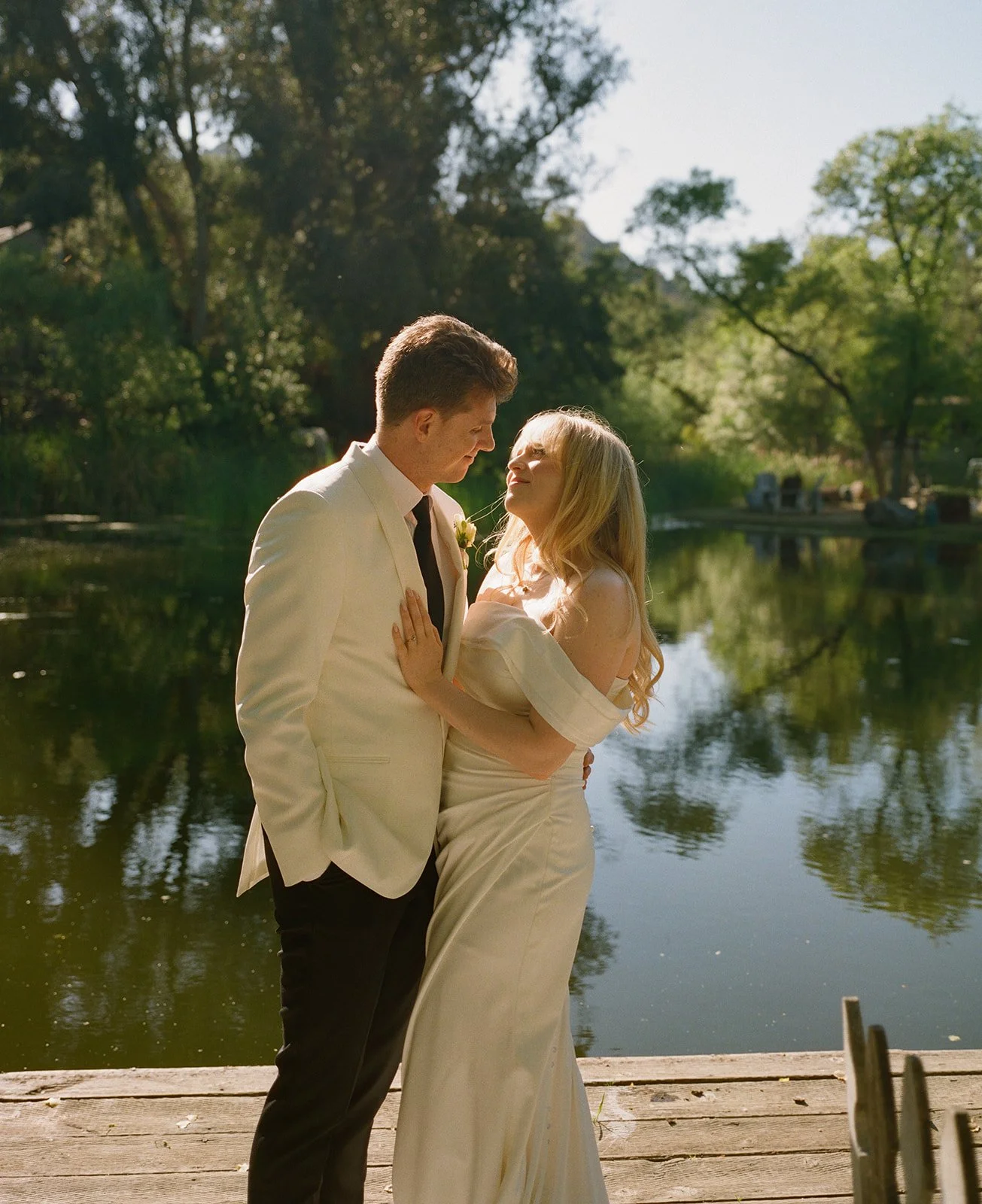 A bride and groom posing for photos at their Calamigos Ranch wedding