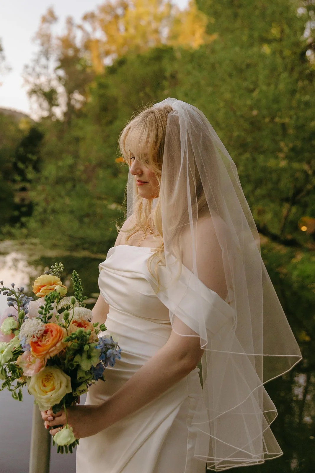 A bridal portrait in front of a lake