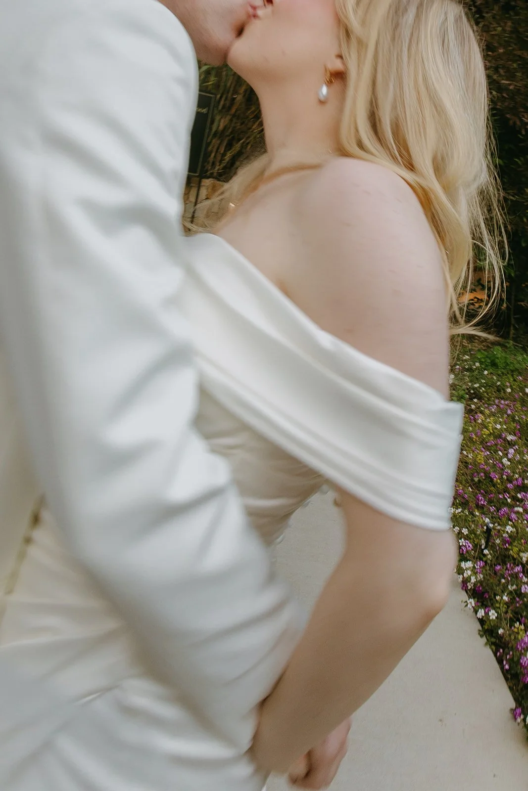 A bride and groom posing for photos at their Calamigos Ranch wedding