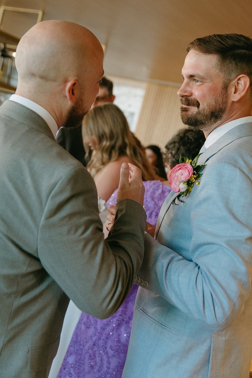 A candid photo of wedding guests at a cocktail hour