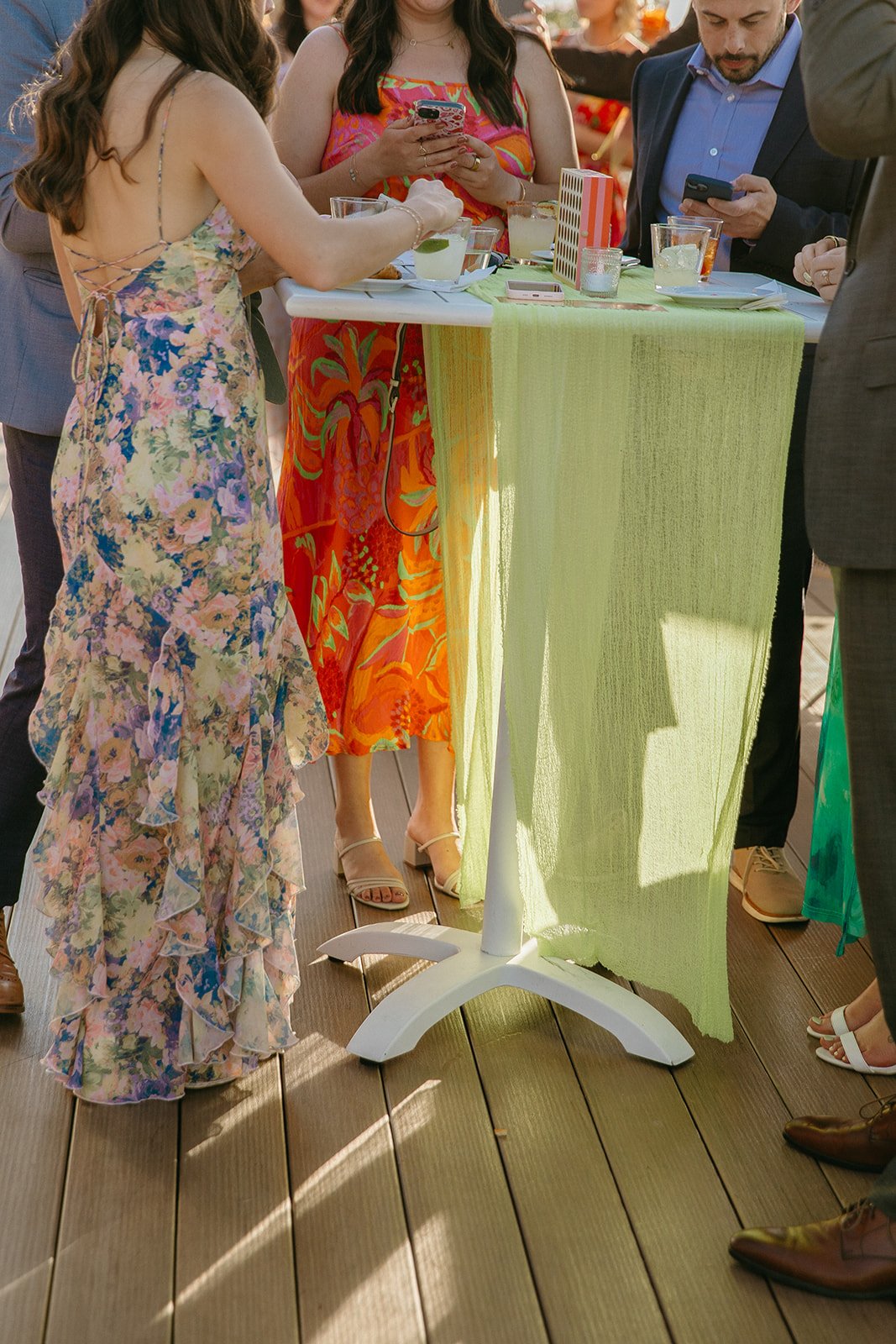 A candid photo of wedding guests at a cocktail hour