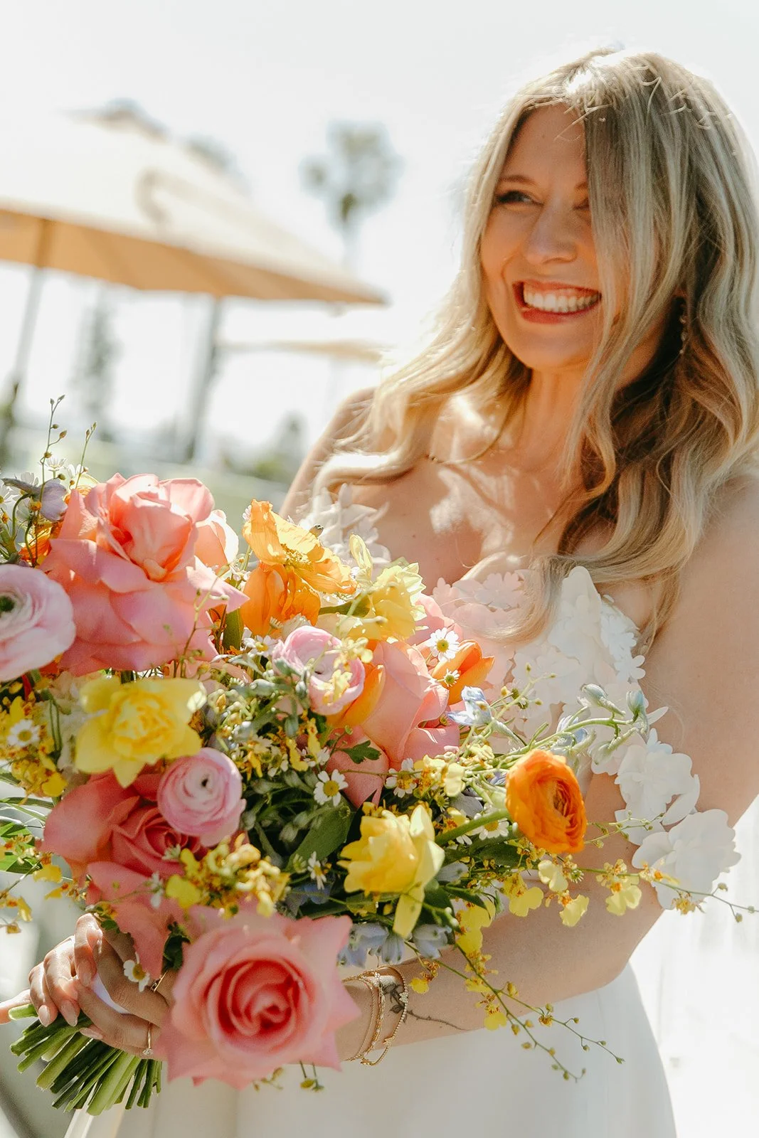 A bride holding a colorful wedding bouquet