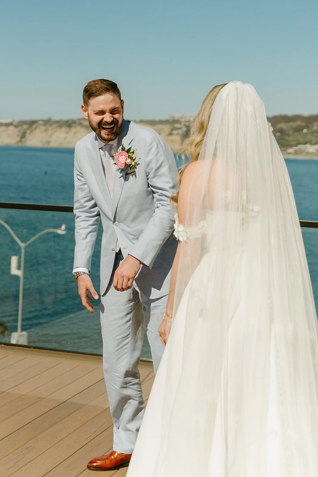 A groom's reaction to a first look with his bride