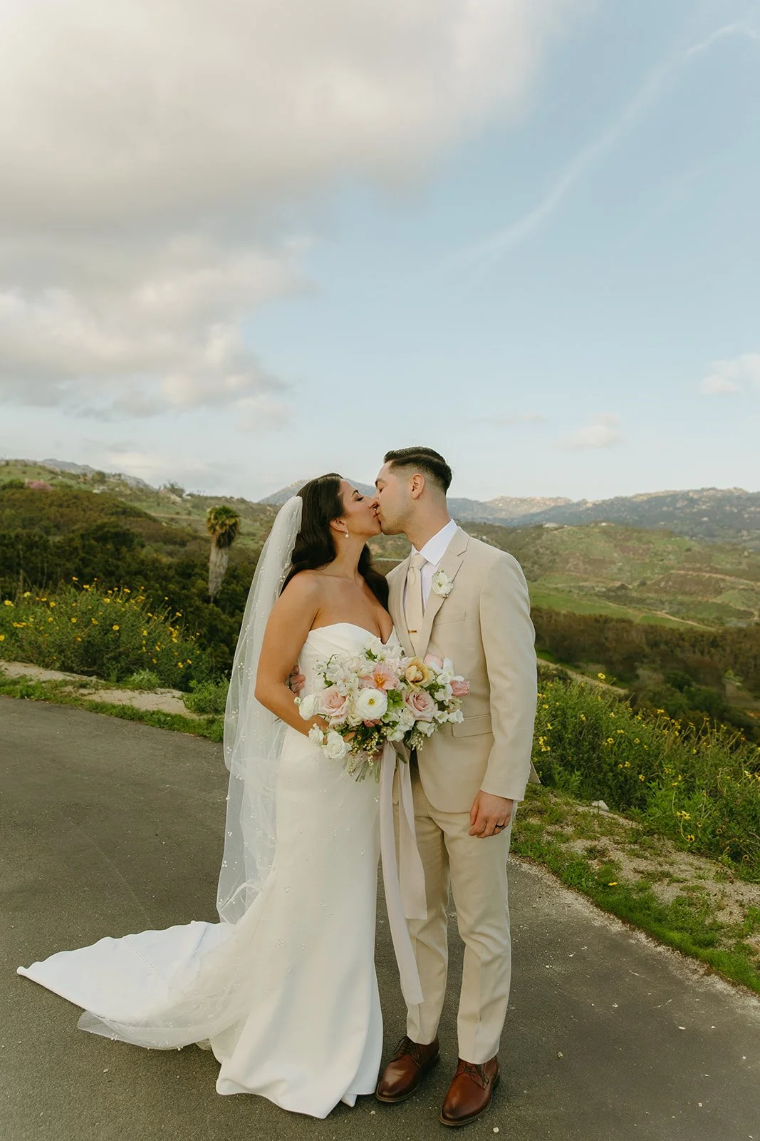 A bride and groom posing for wedding photos at Tivoli