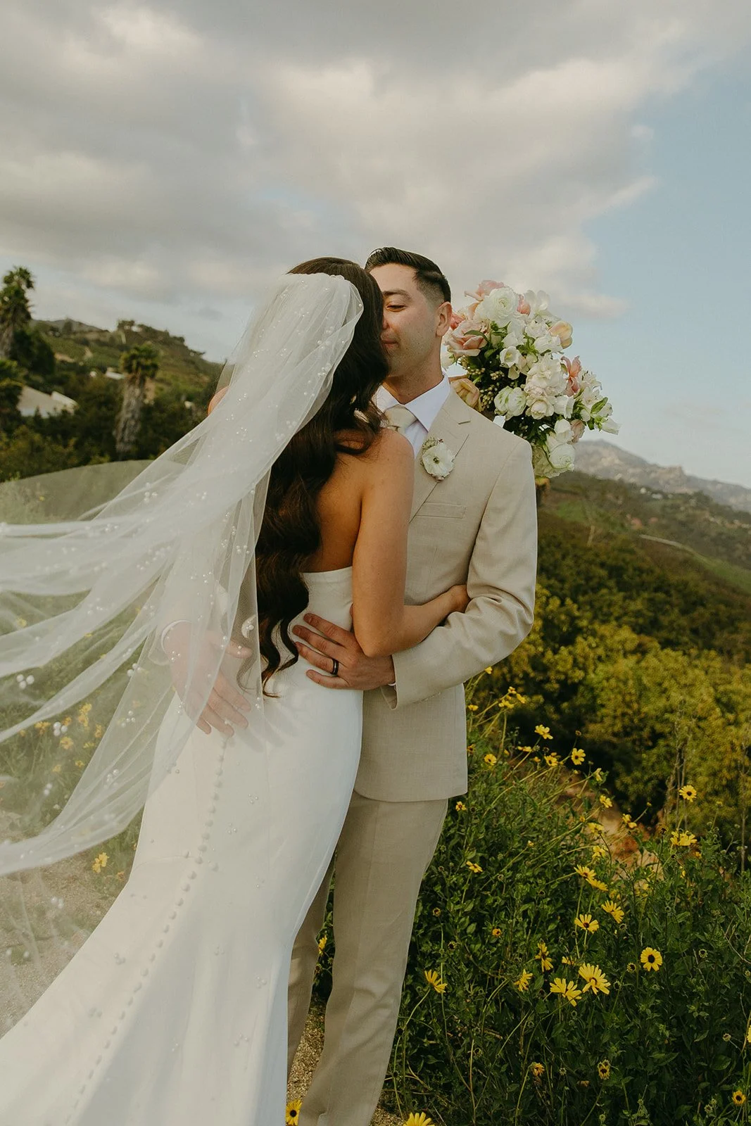 A bride and groom posing for wedding photos at Tivoli