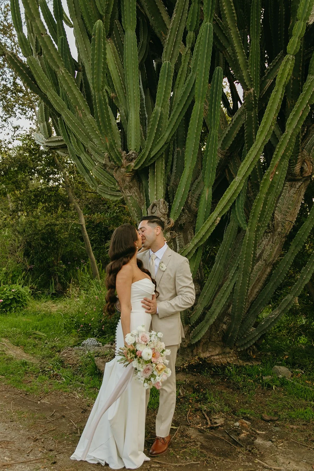 A bride and groom taking wedding photos in front of Tivoli