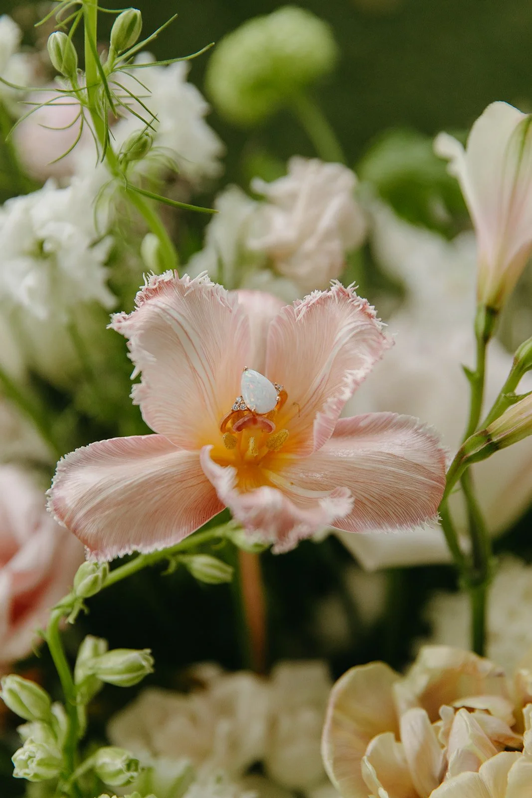 A wedding ring in a flower as a wedding detail photo