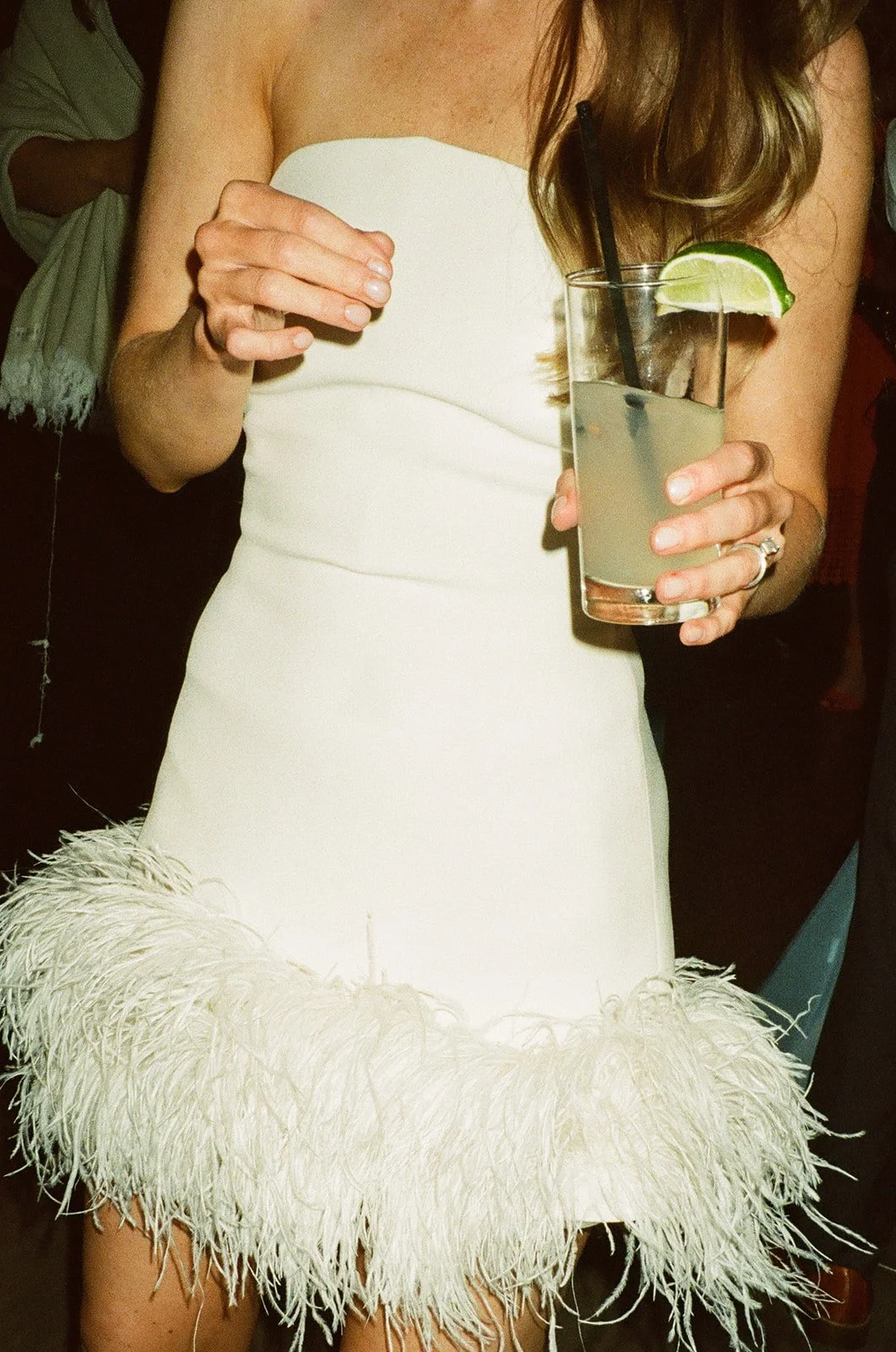 A bride in her feather wedding reception dress