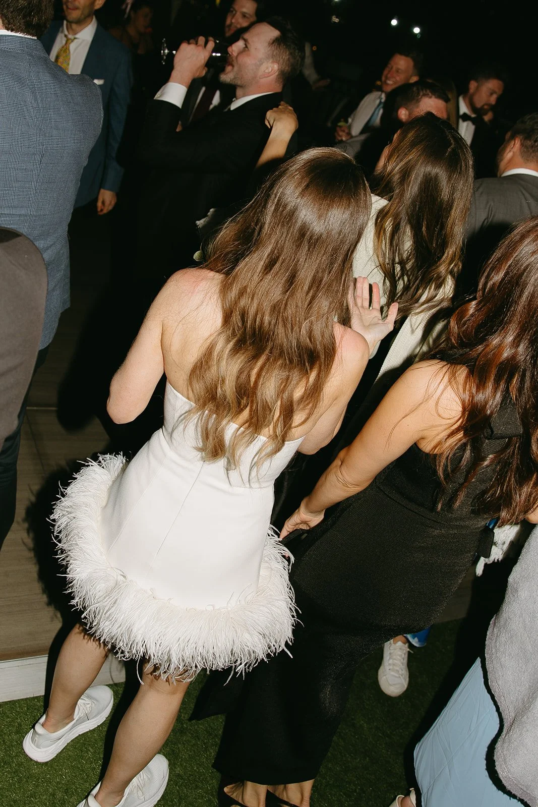 A bride in her feather wedding reception dress