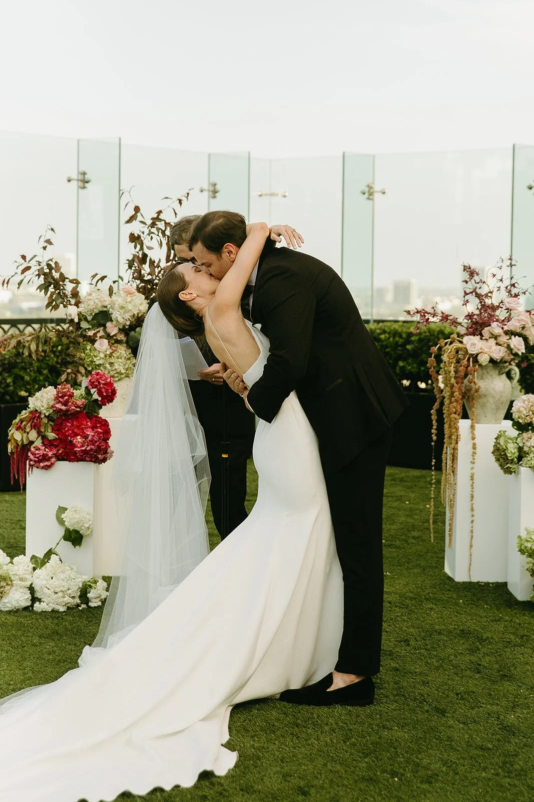 A couple during their wedding first kiss