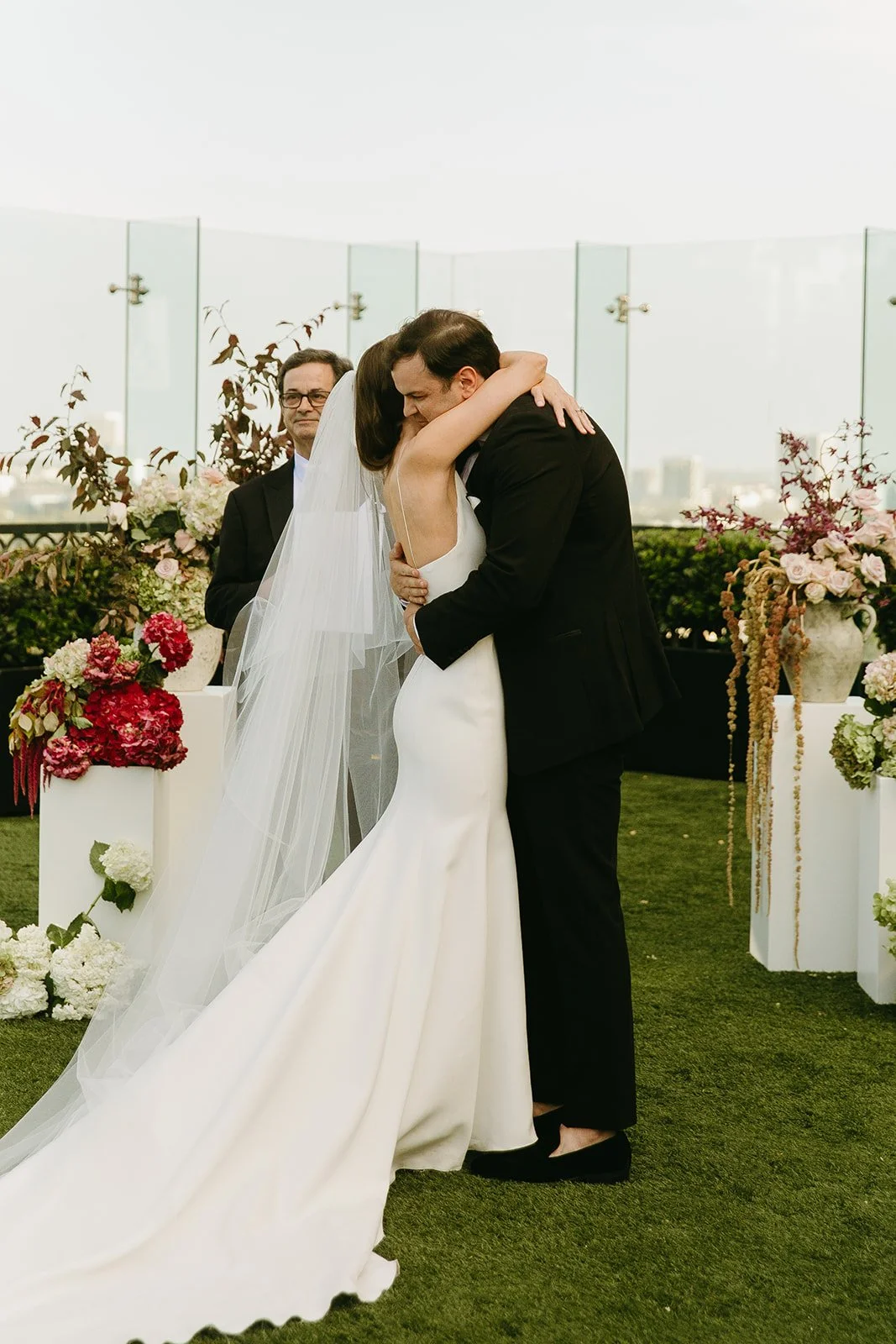 A couple hugging after their wedding ceremony