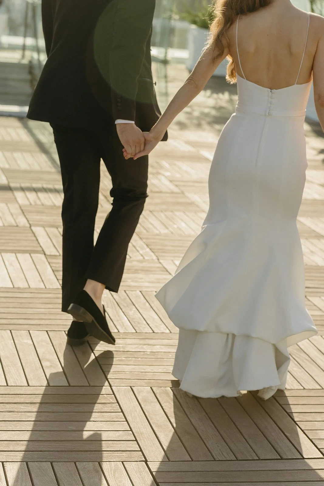 A couple taking wedding photos at their wedding location in Southern California, the London