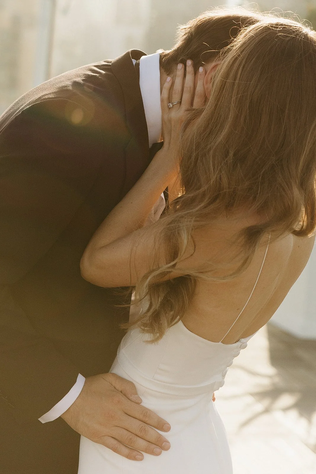 A couple taking wedding photos at their wedding location in Southern California, the London