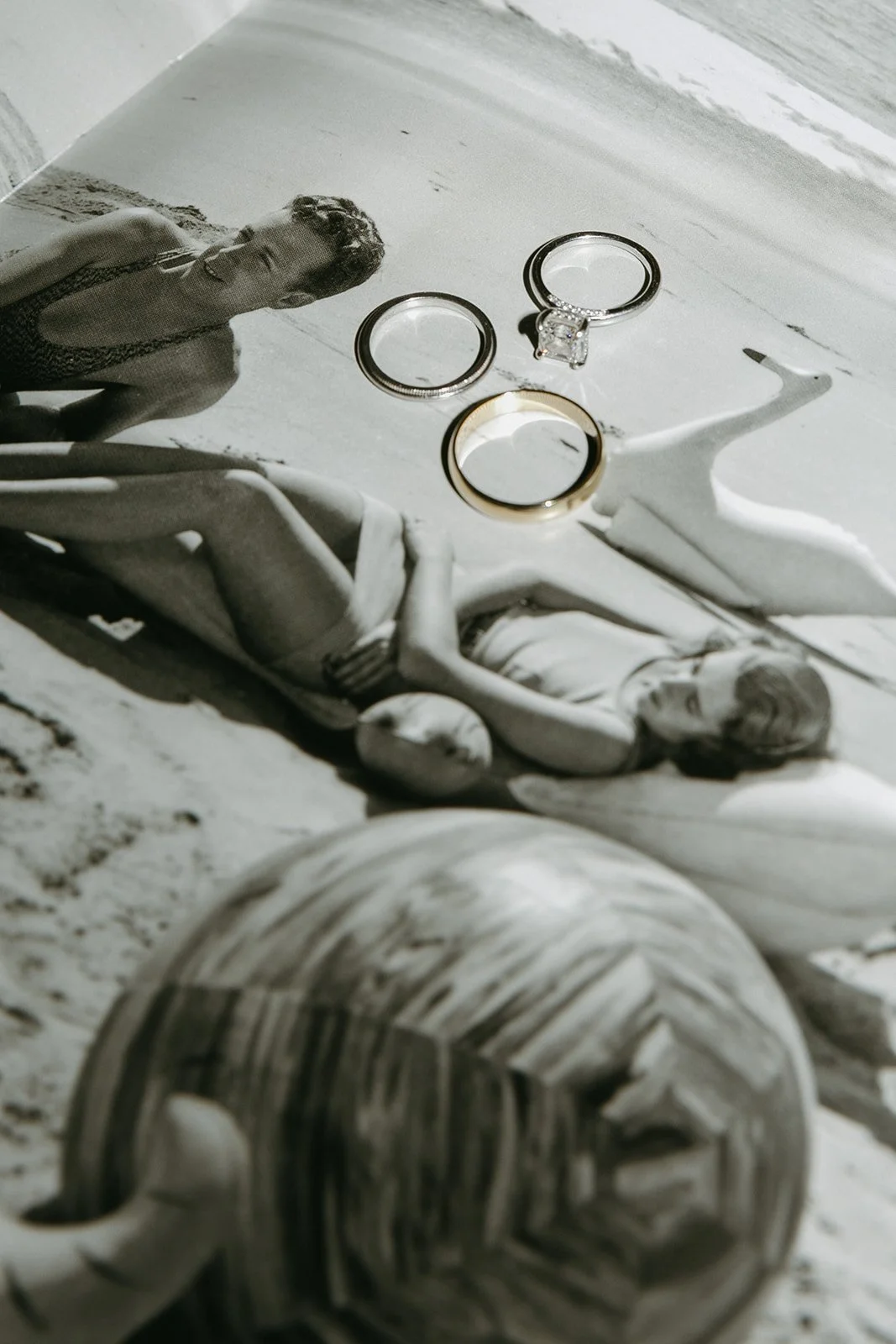 A couple's wedding rings in a wedding flat lay