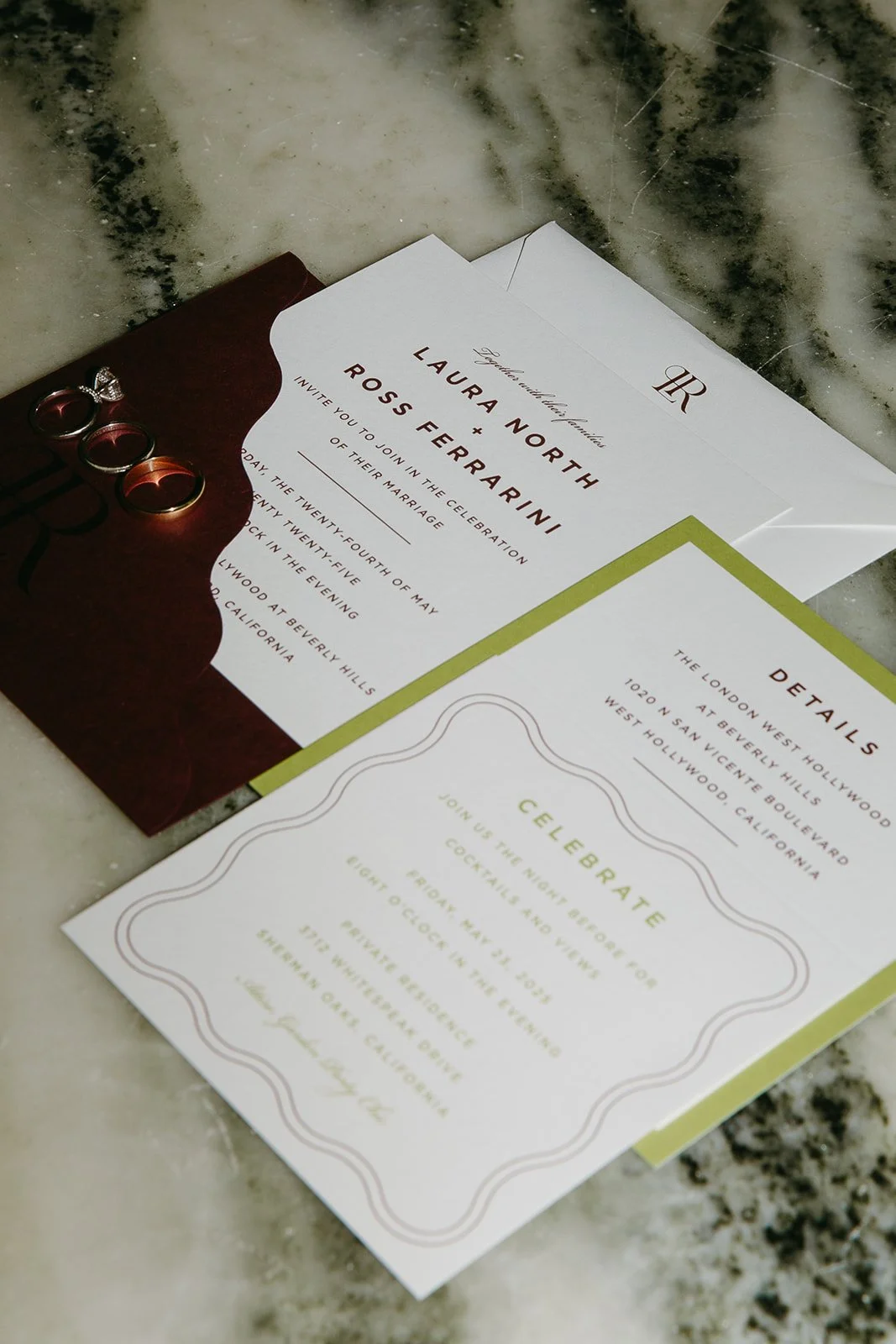 A wedding invitation in a flat lay