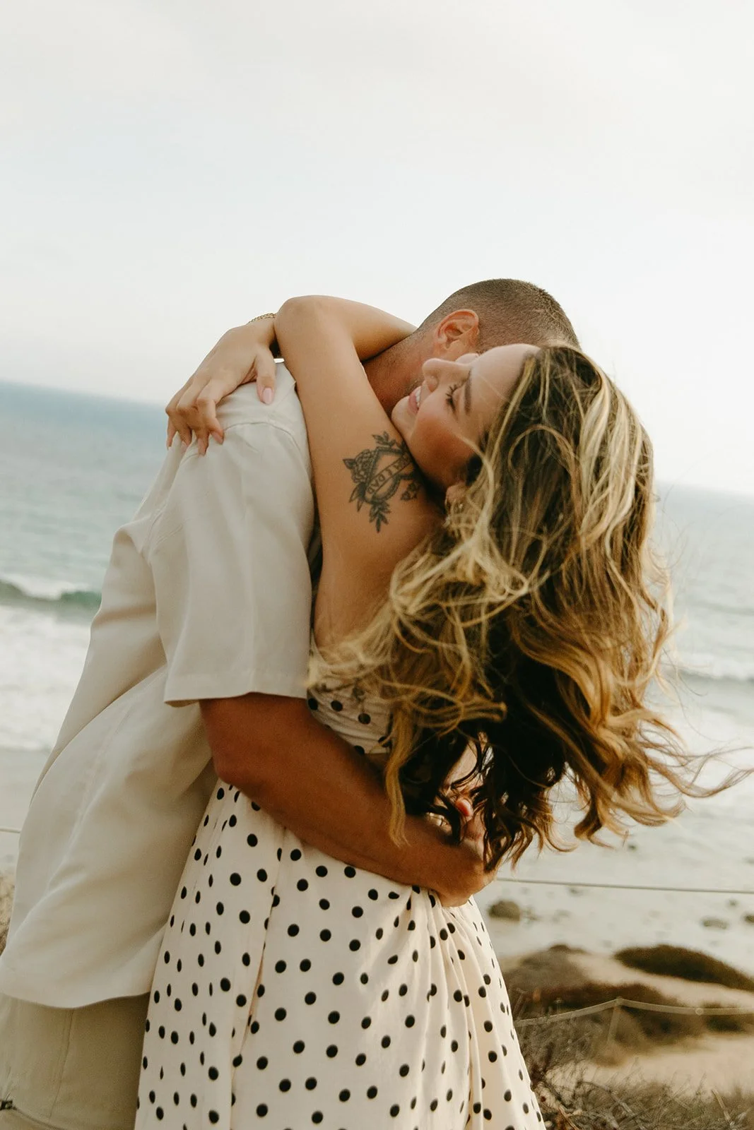 A couple hugging during Southern California engagement photos
