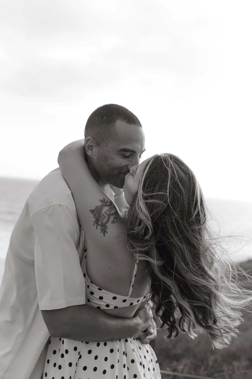 A couple hugging for engagement photos