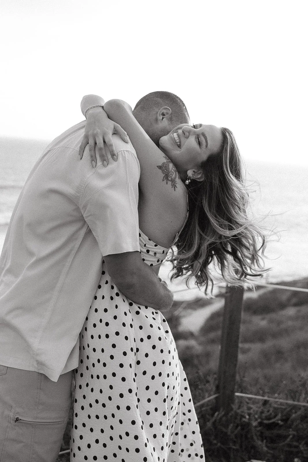 A couple hugging for engagement photos