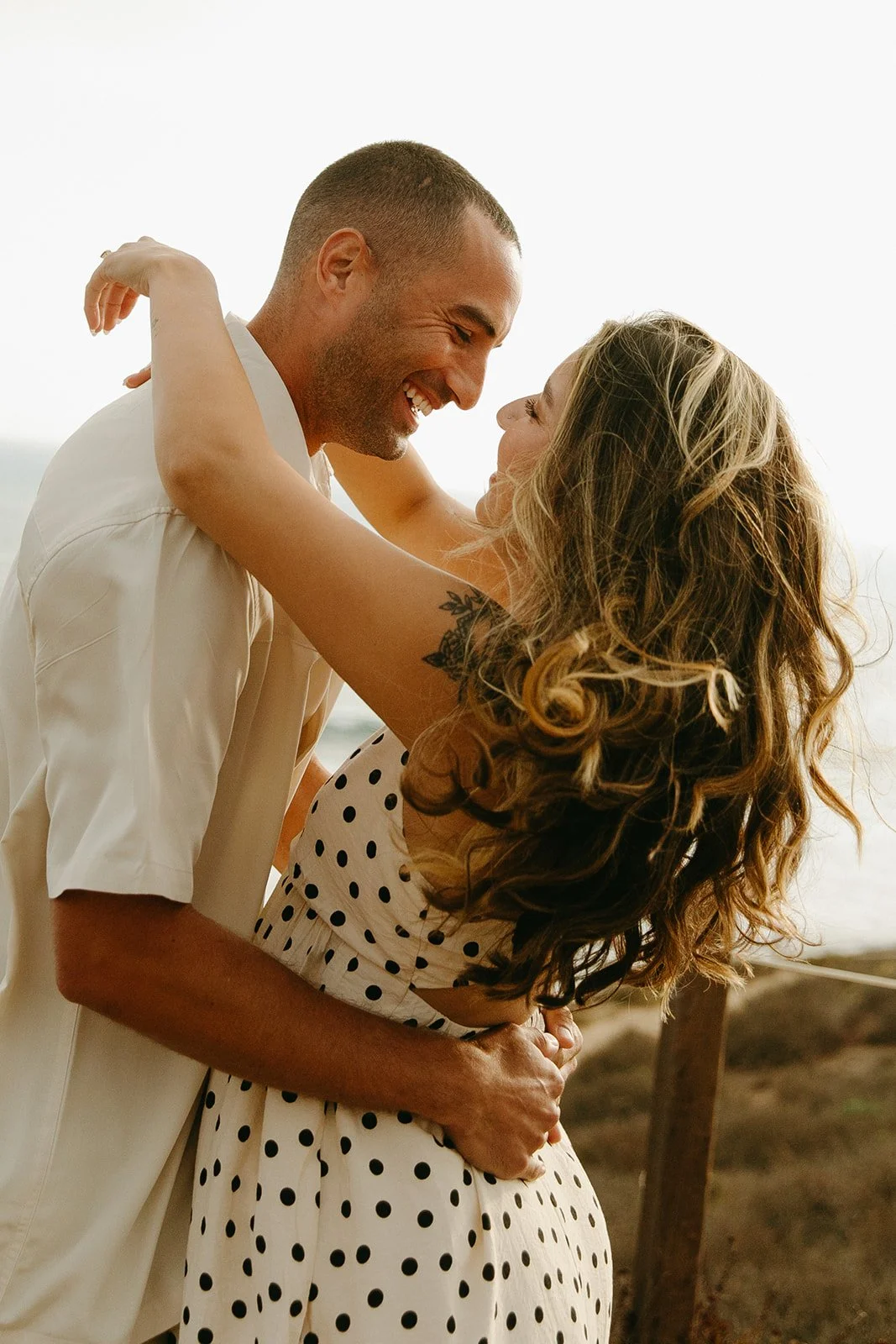 A couple hugging during engagement photos