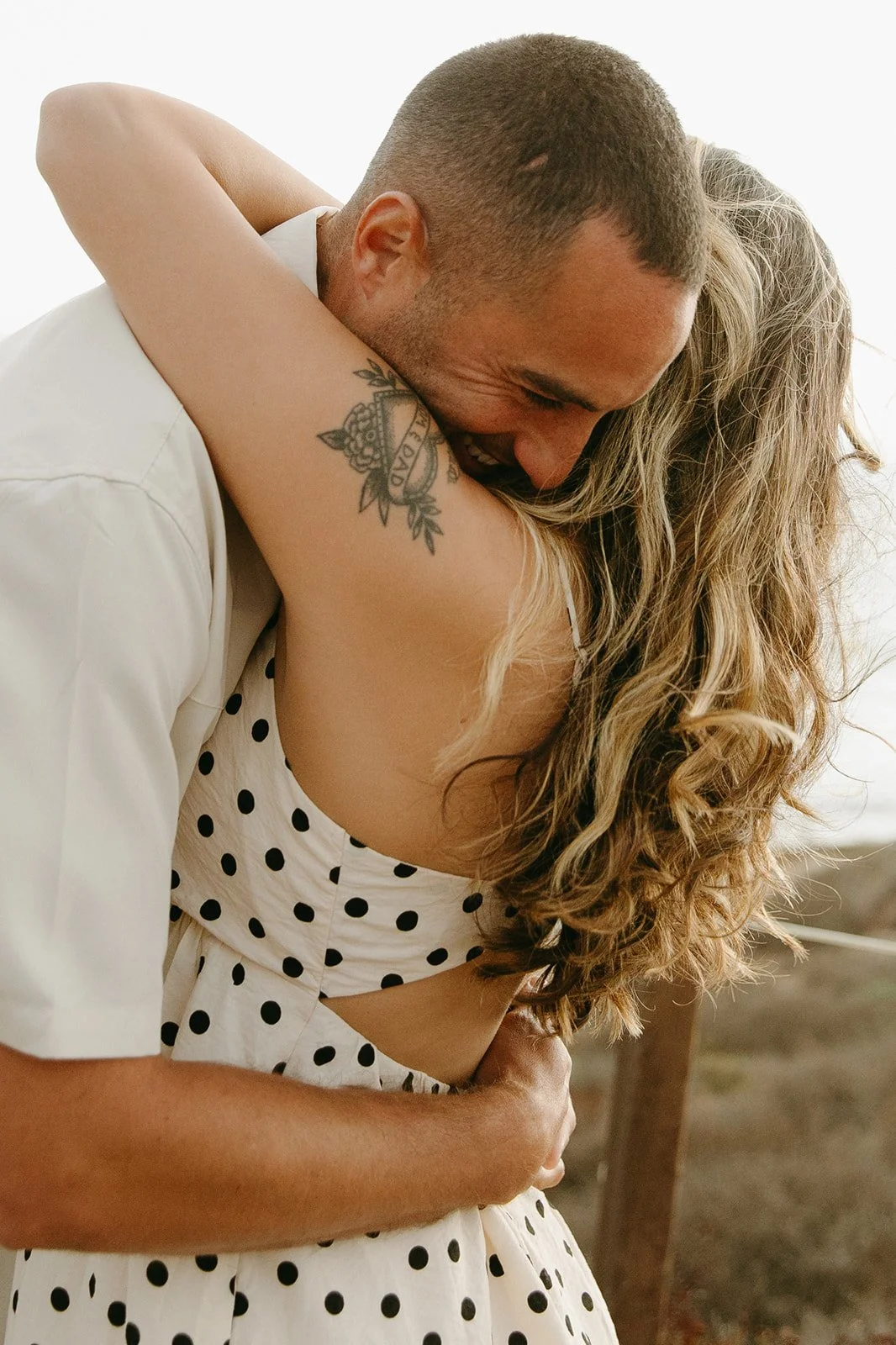 A couple hugging during engagement photos