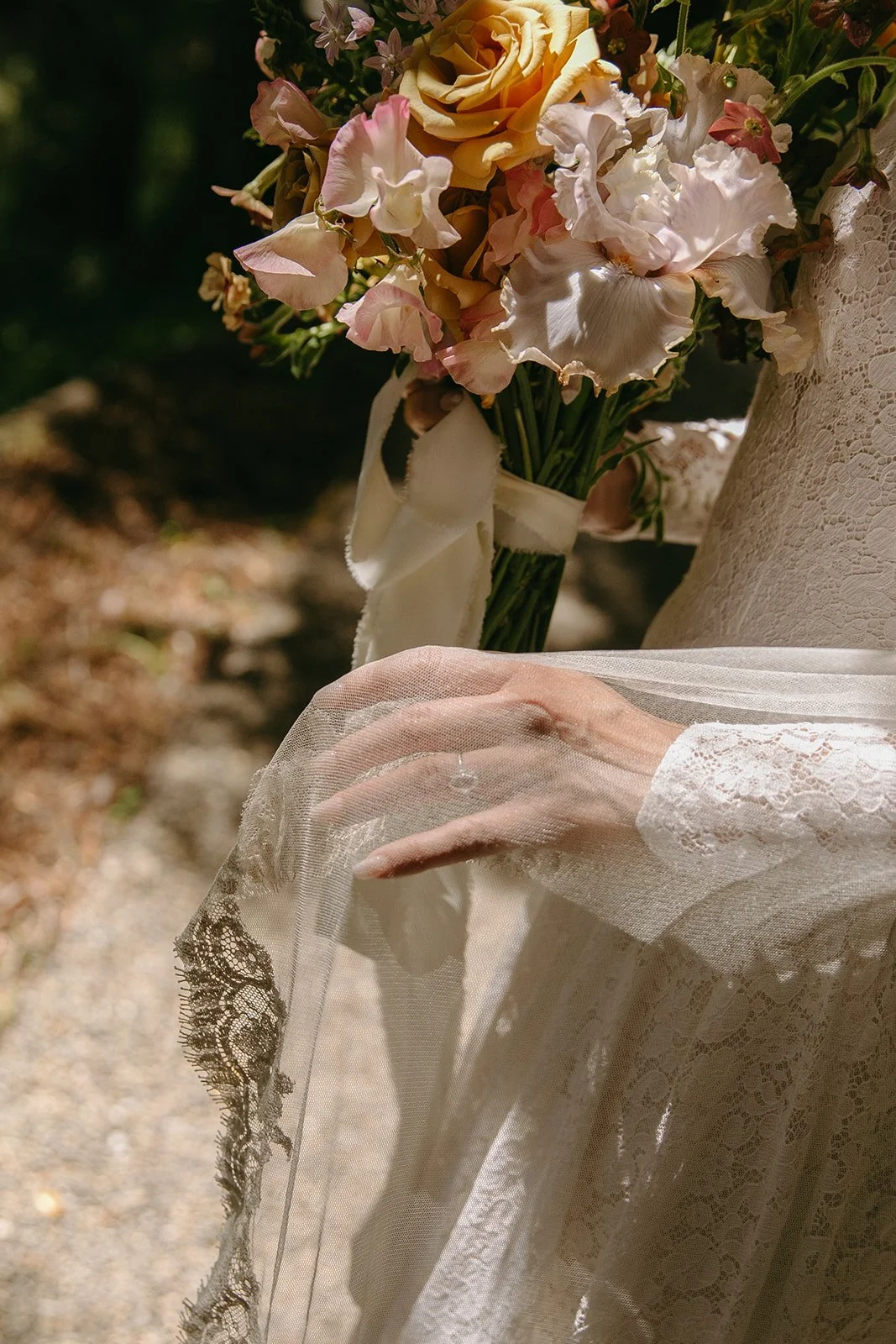 A bride holding a bouquet for a garden wedding
