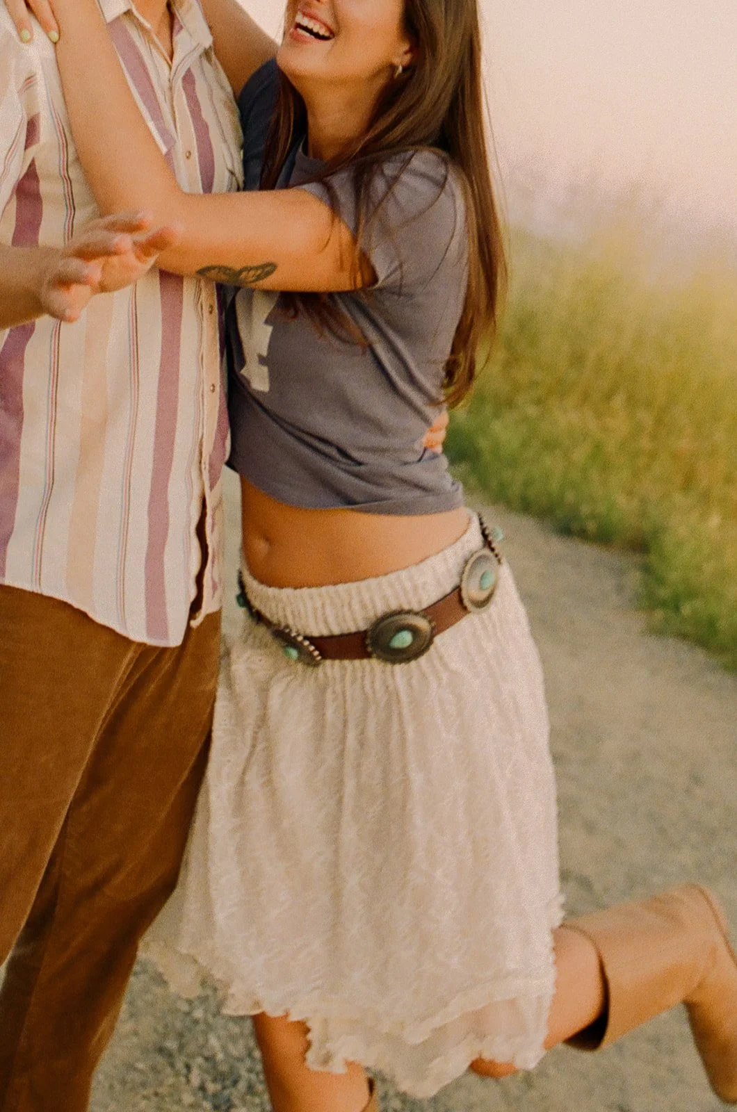 A close-up photo of a couple's Laguna Beach engagement photo outfits