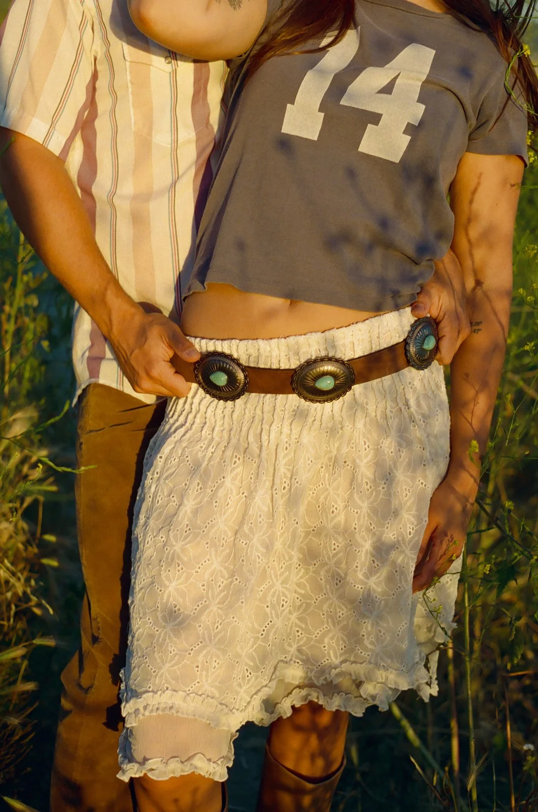 A close-up photo of a couple's Laguna Beach engagement photo outfits