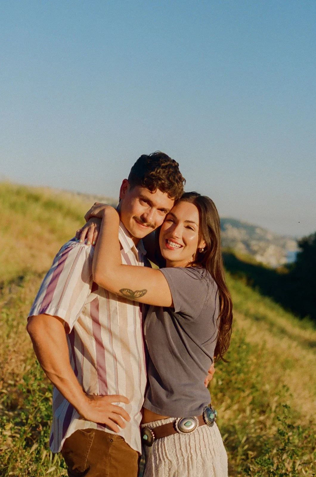 A couple posing for Laguna Beach engagement photos