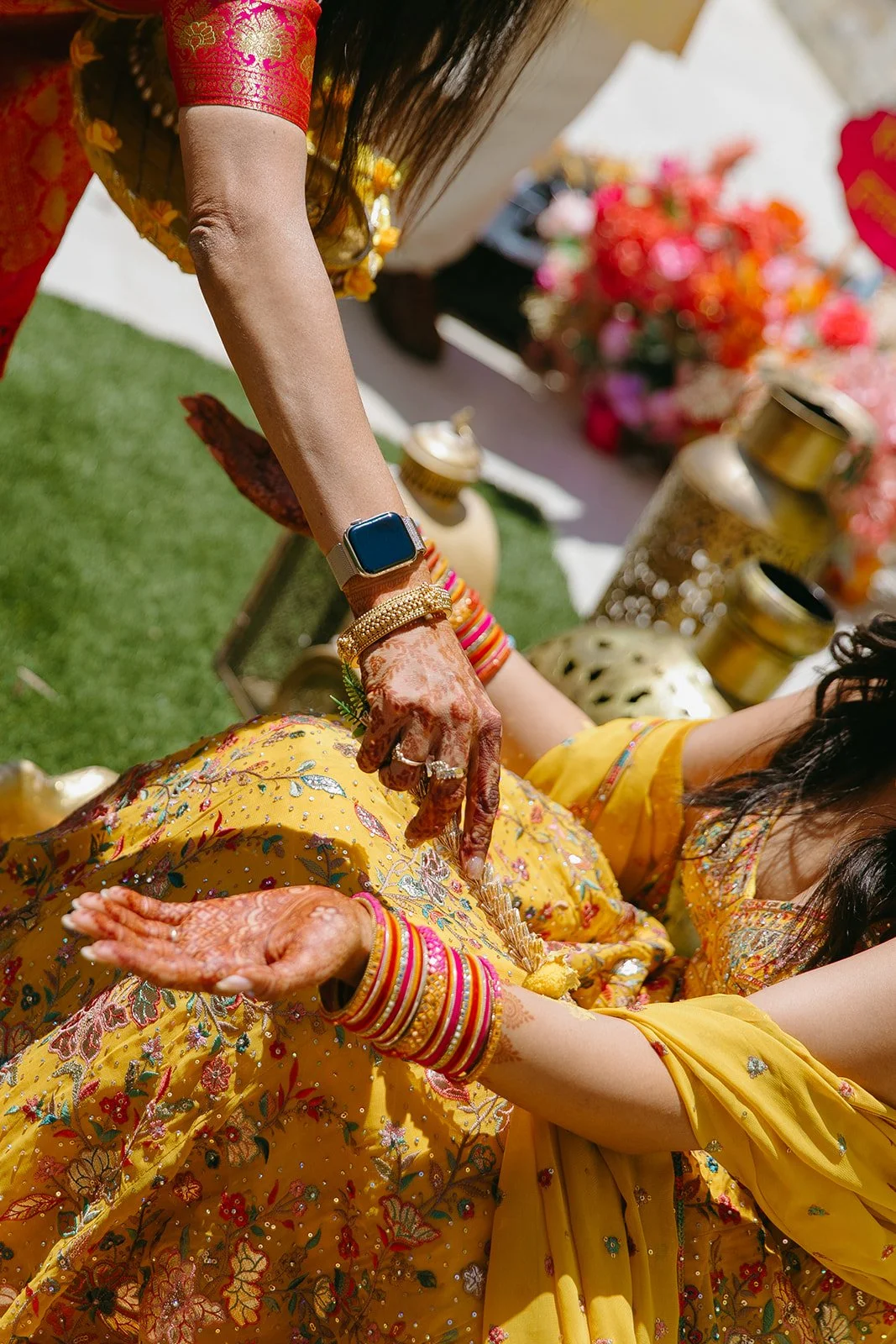 A bride having turmeric put on her for her Indian wedding