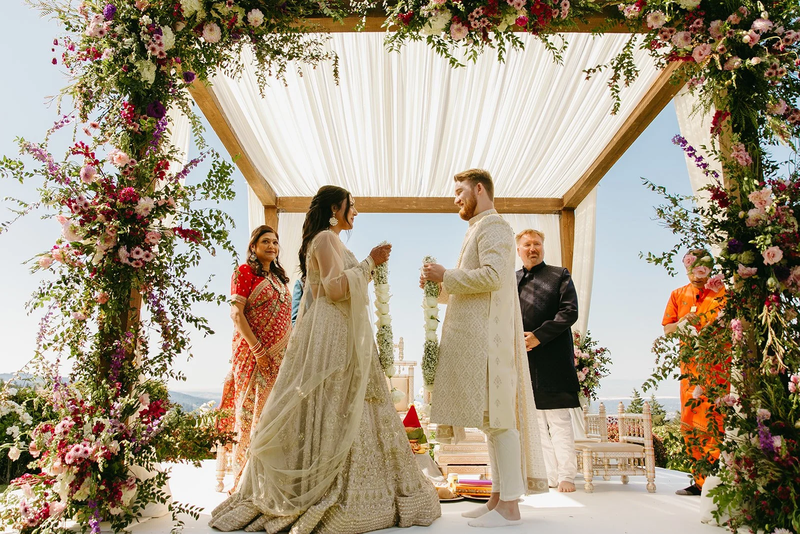 A garland exchange honoring wedding traditions at an Indian wedding