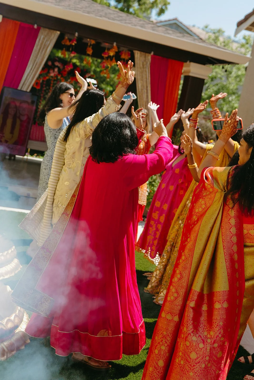 Guests at a Mehndi ceremony dancing for wedding traditions