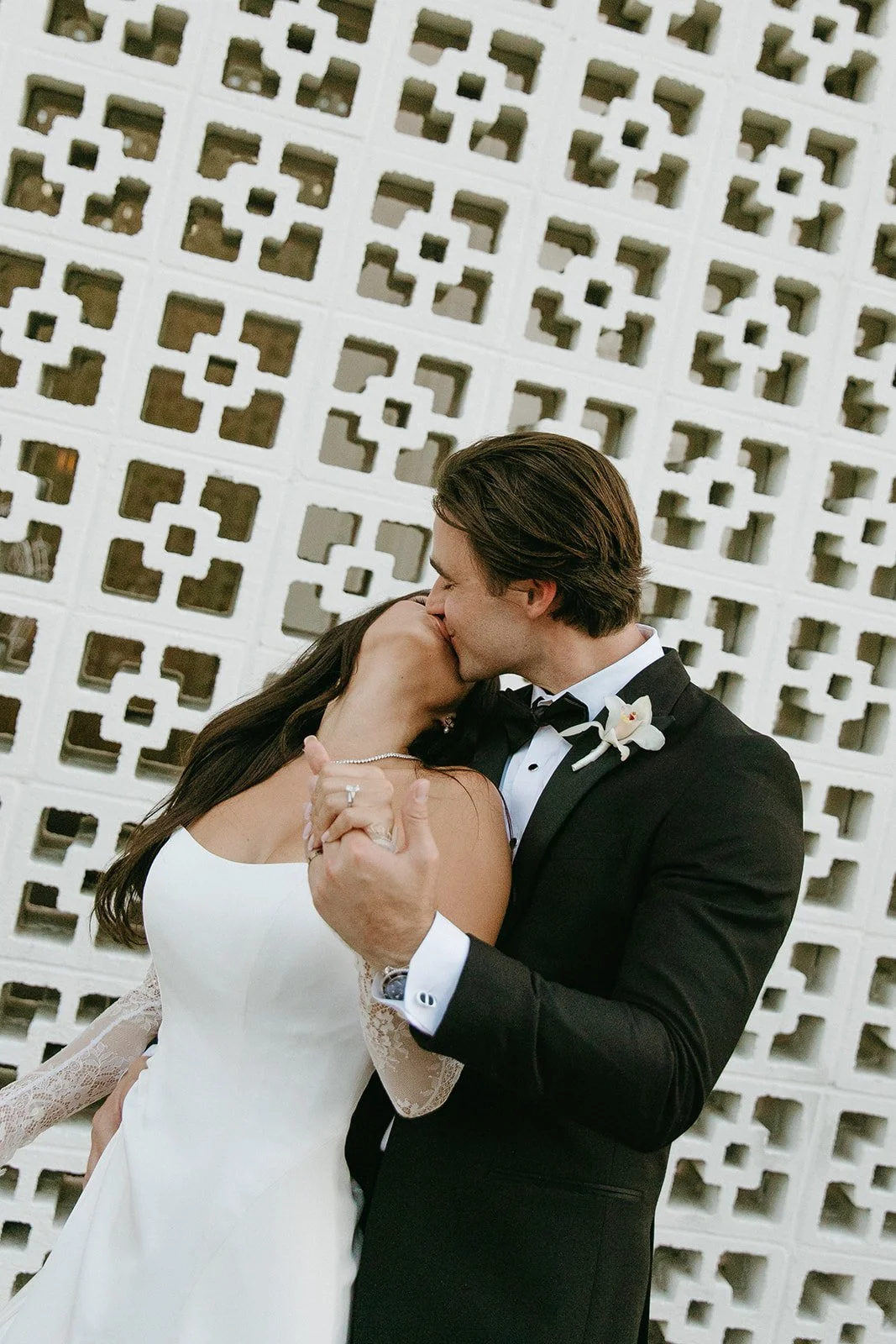A bride and groom taking photos at a venue for Palm Springs weddings