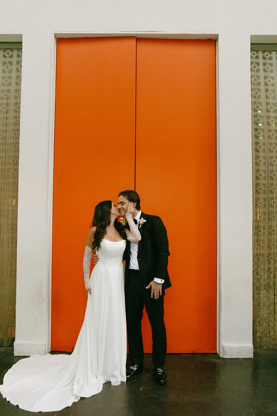 A bride and groom taking photos at a venue for Palm Springs weddings