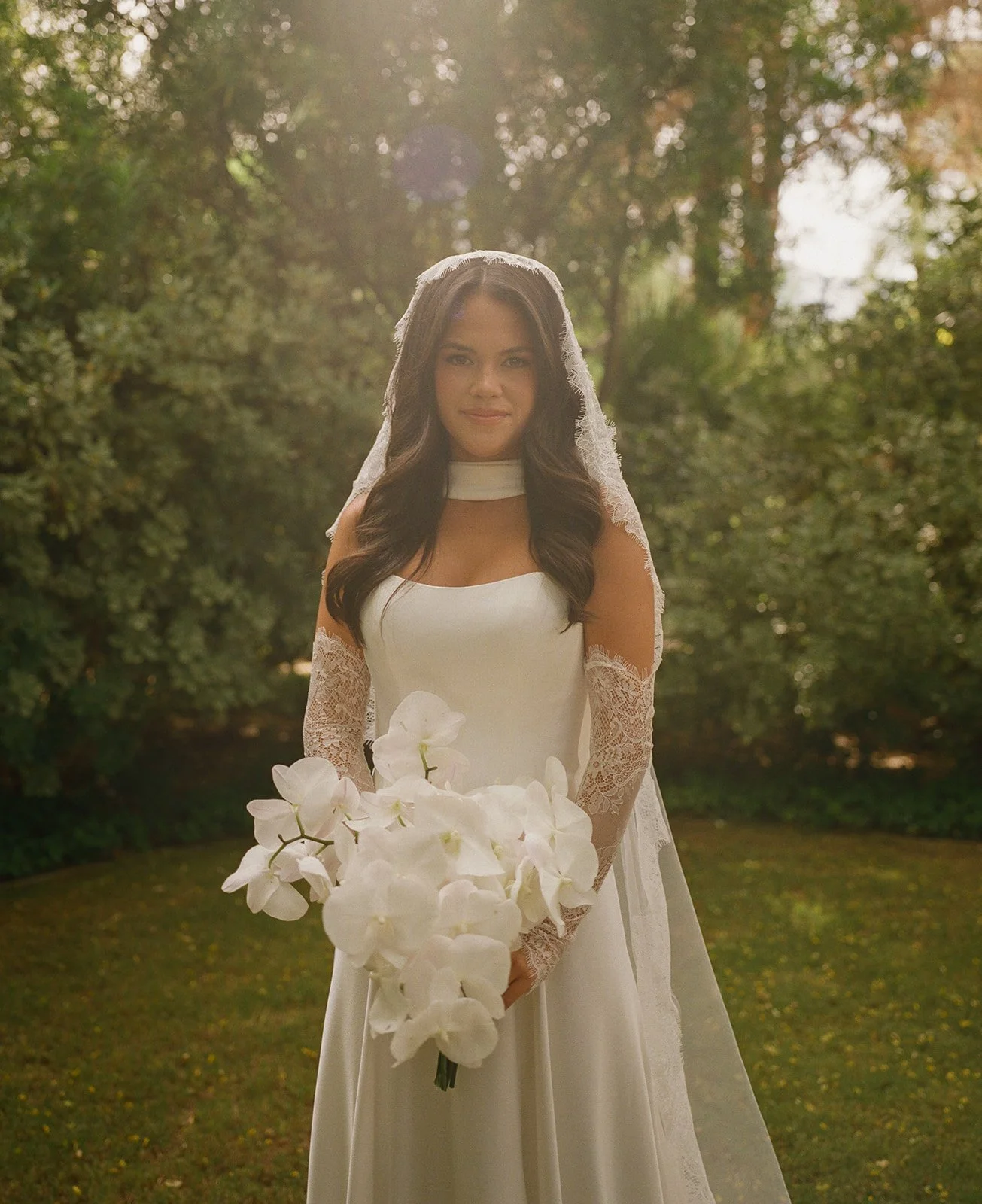 A bridal portrait of a bride in a long sleeve wedding dress