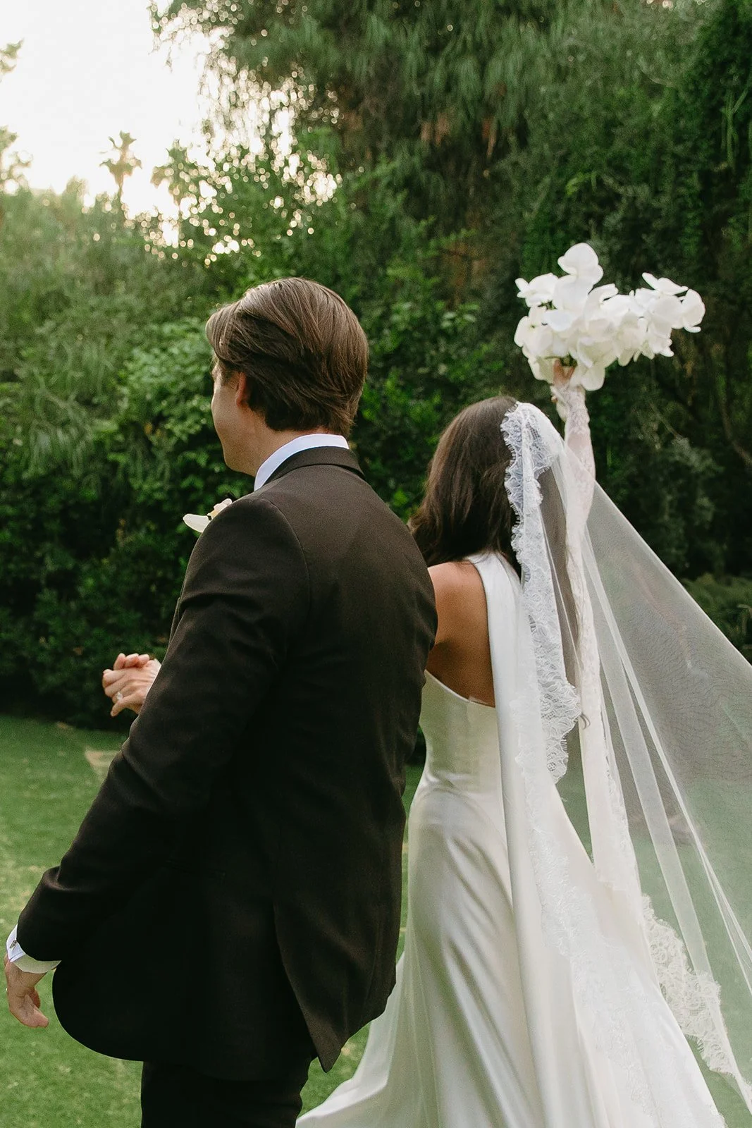 A bride and groom exiting their wedding ceremony