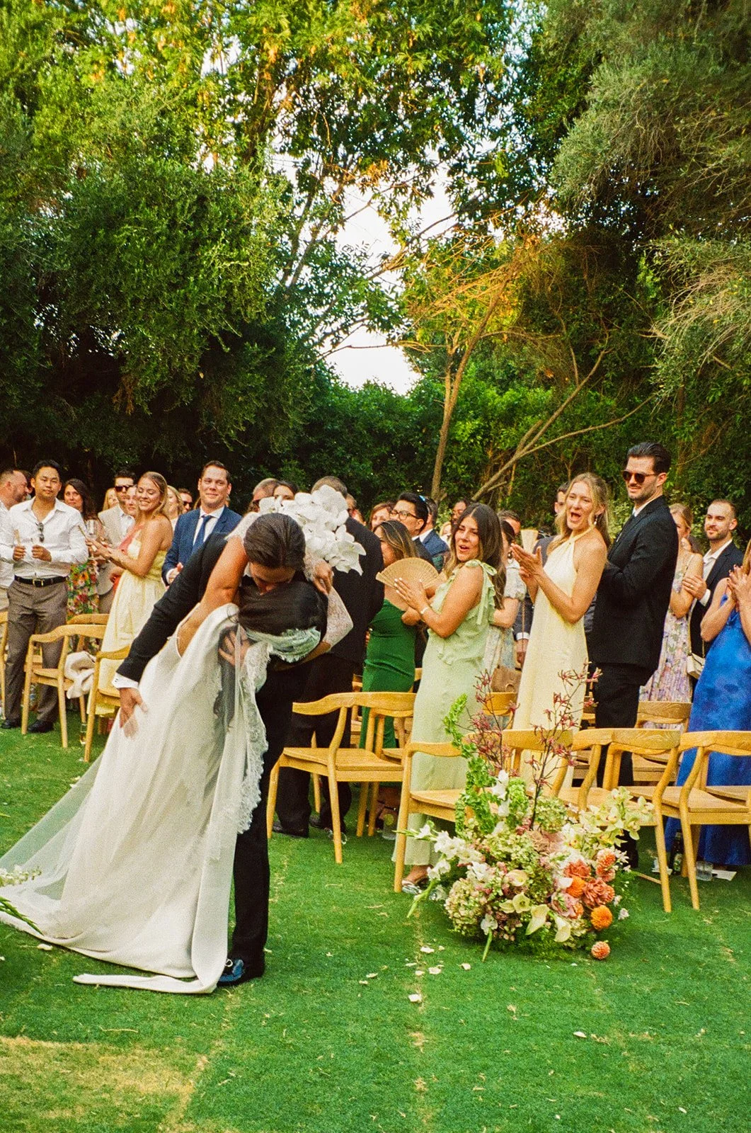 A bride and groom exiting their wedding ceremony