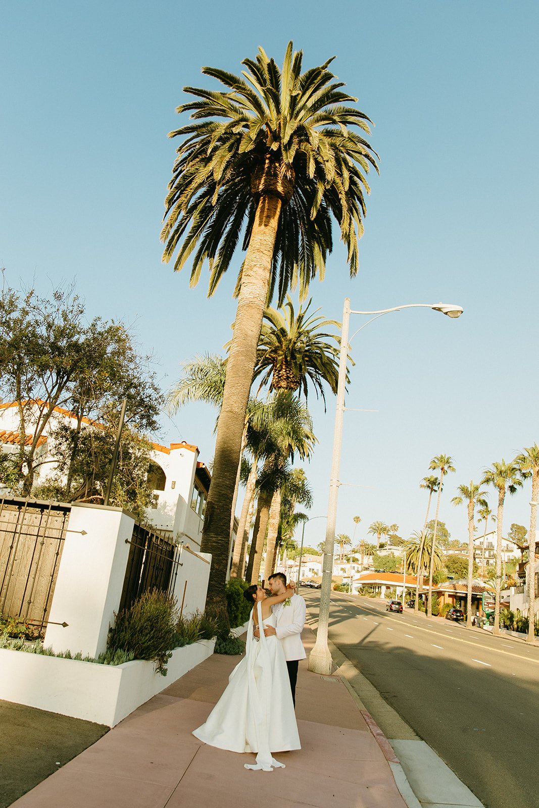 A bride and groom taking San Clemente wedding photos