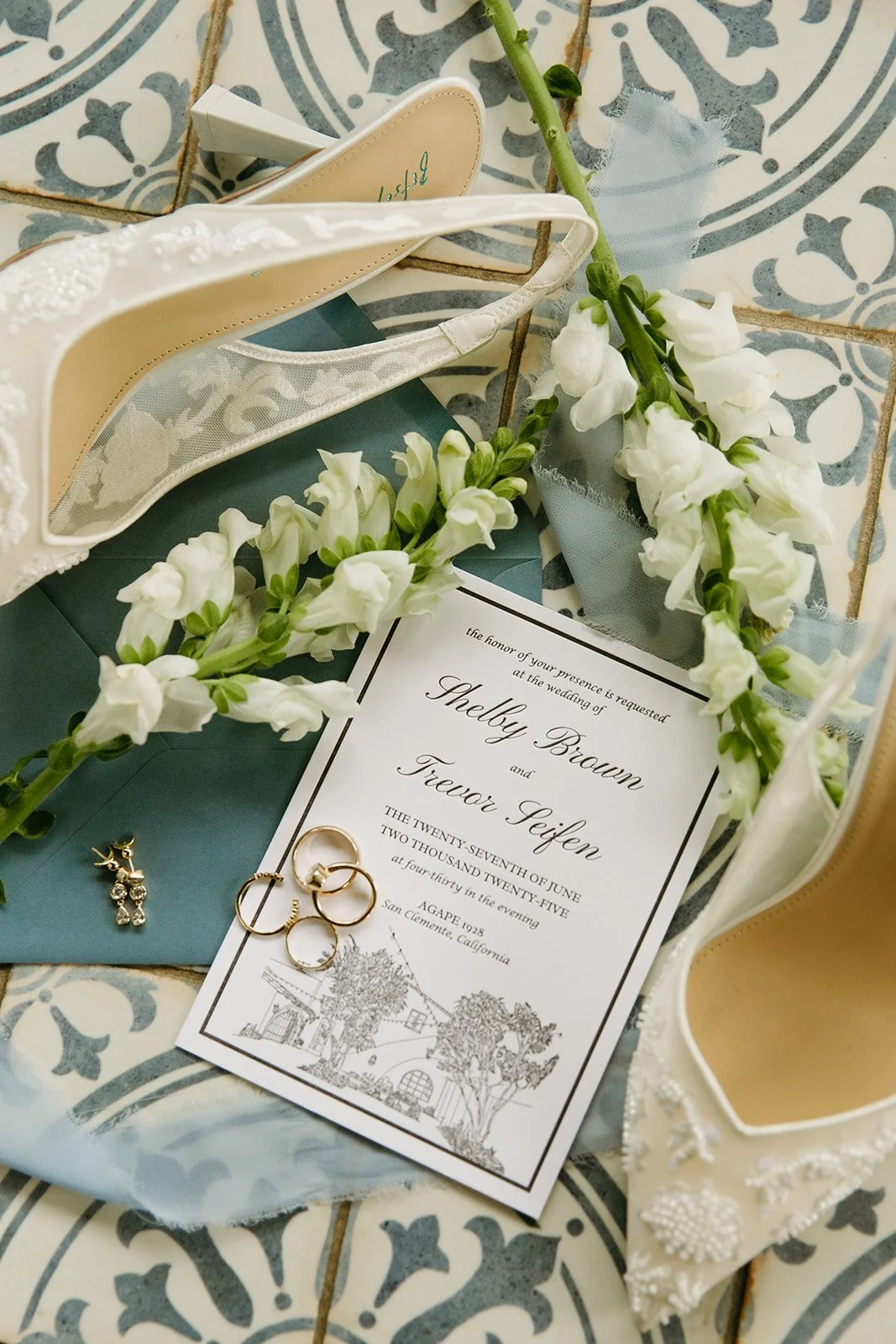 A wedding flat lay with wedding invitations as wedding design ideas