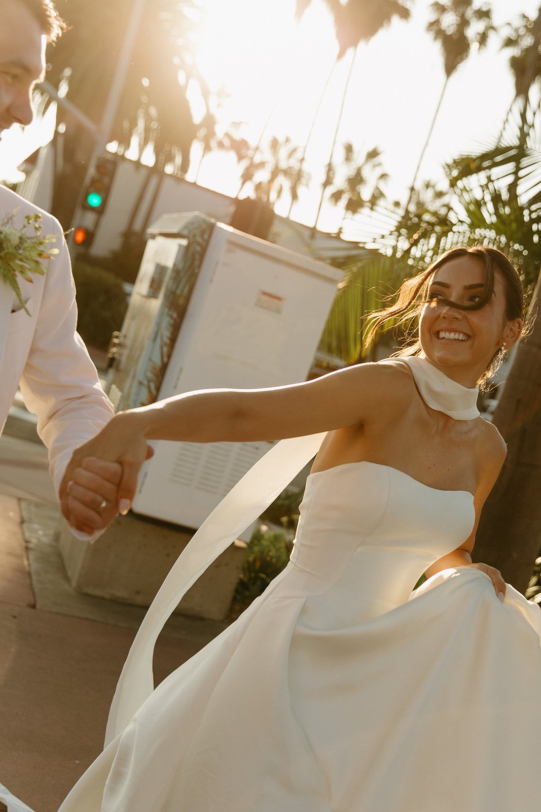 A couple taking sunset wedding photos in san clemente