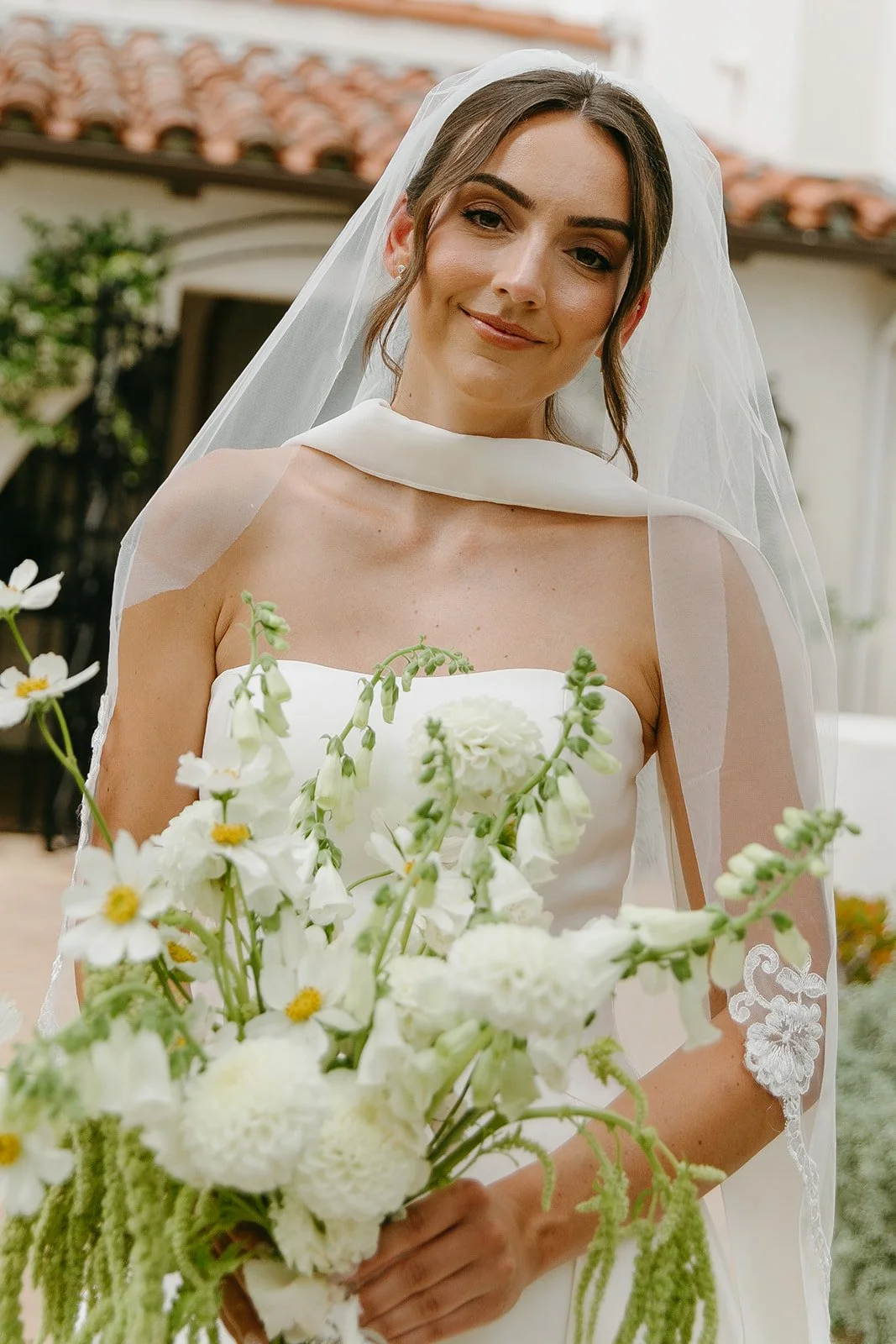 A bride posing for photos at her san clemente wedding