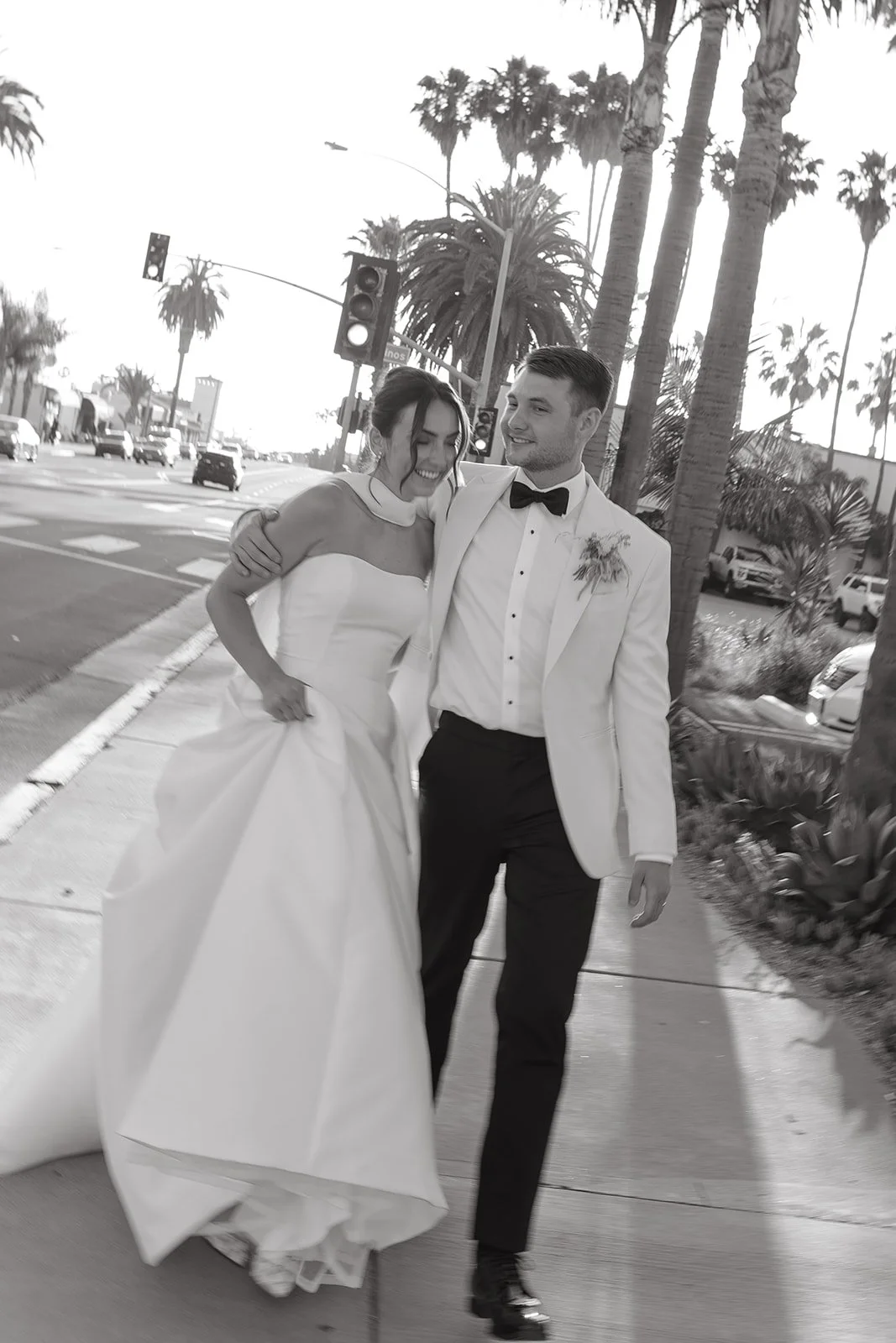A black and white photo of a bride and groom in san clemente
