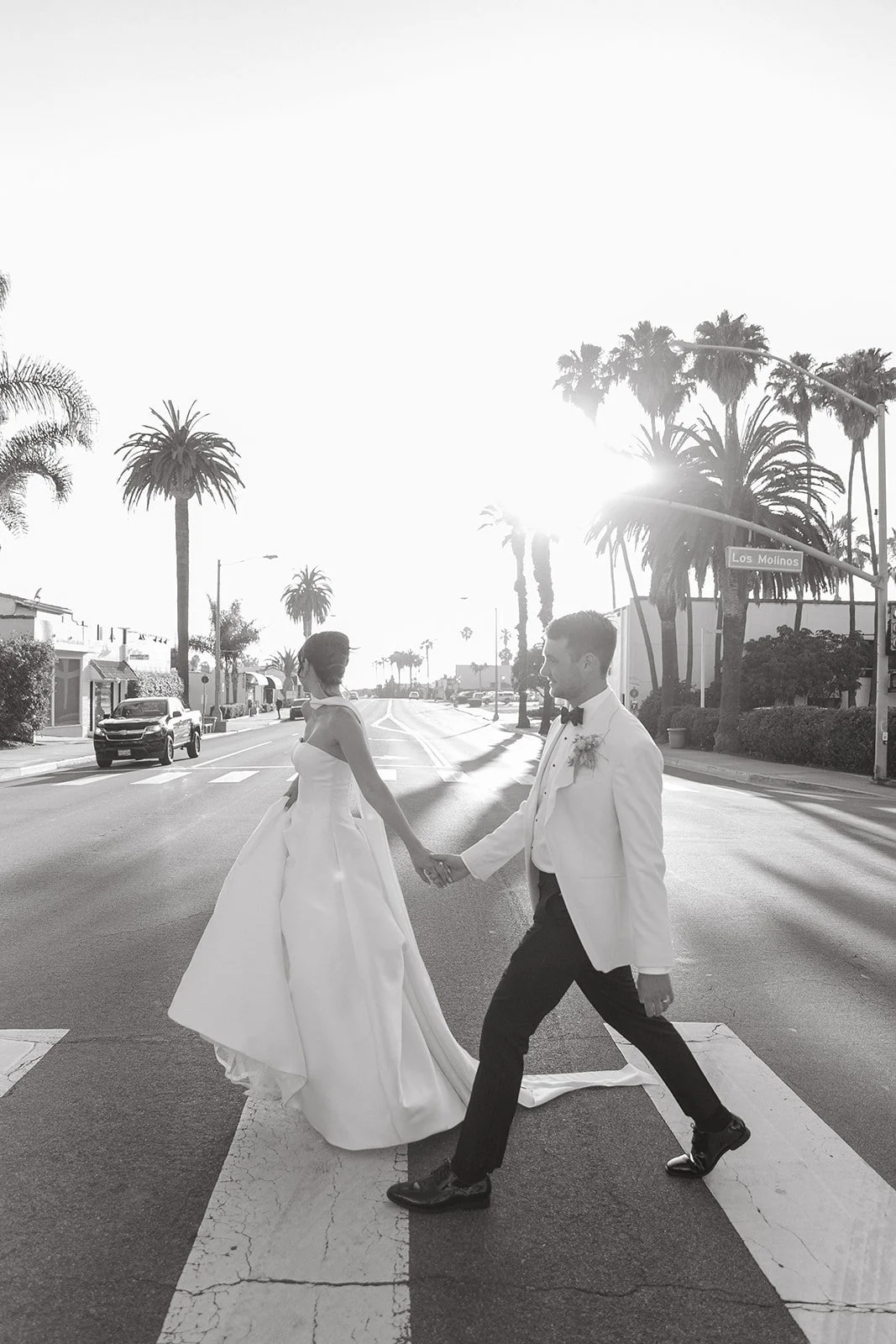 A black and white photo of a bride and groom in san clemente