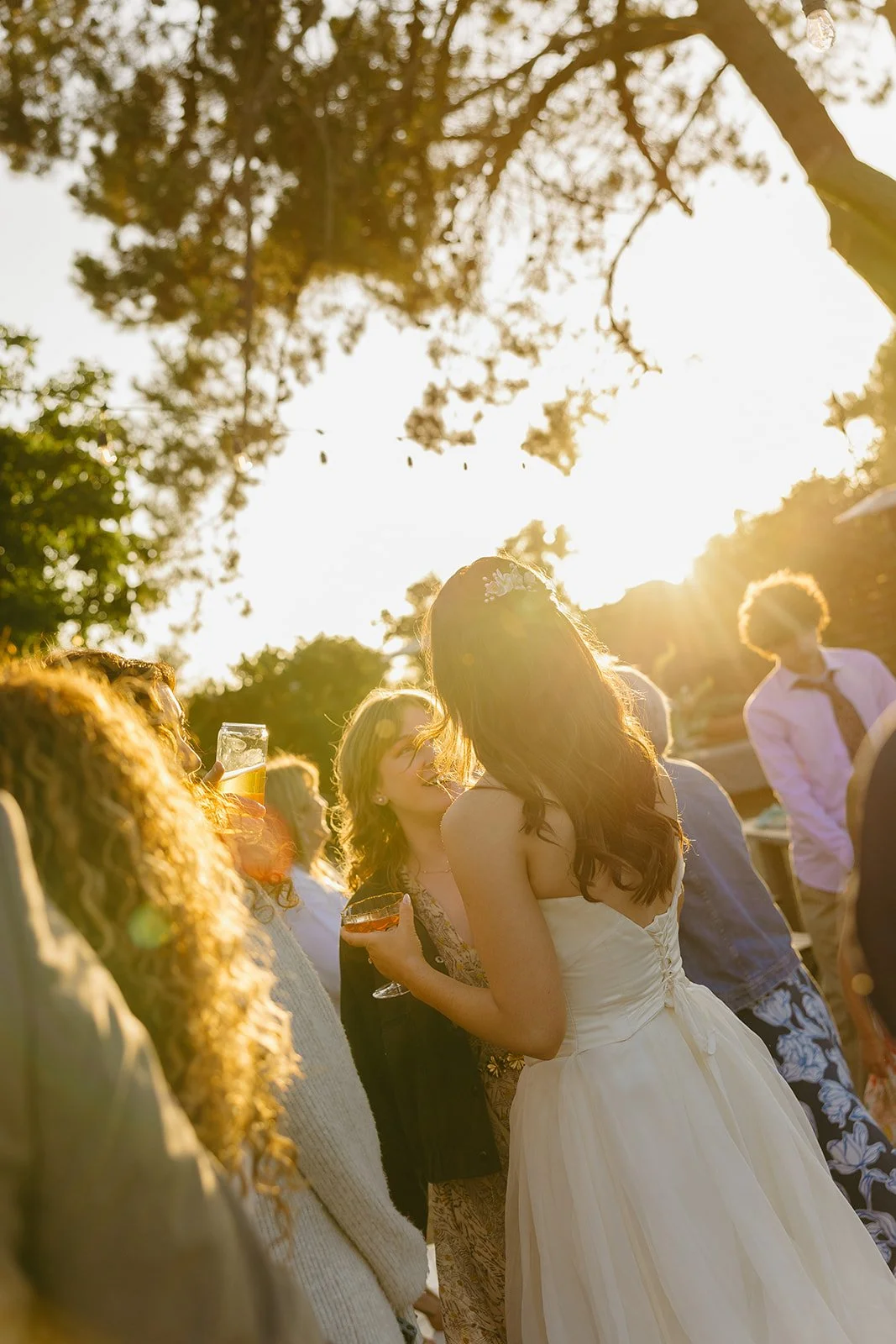 A bride talking to wedding guests  at her wedding reception